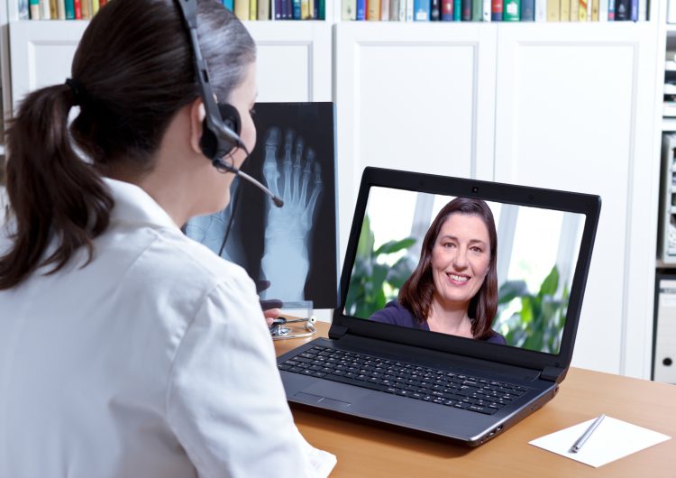 a businesswoman talking with client via VoiP